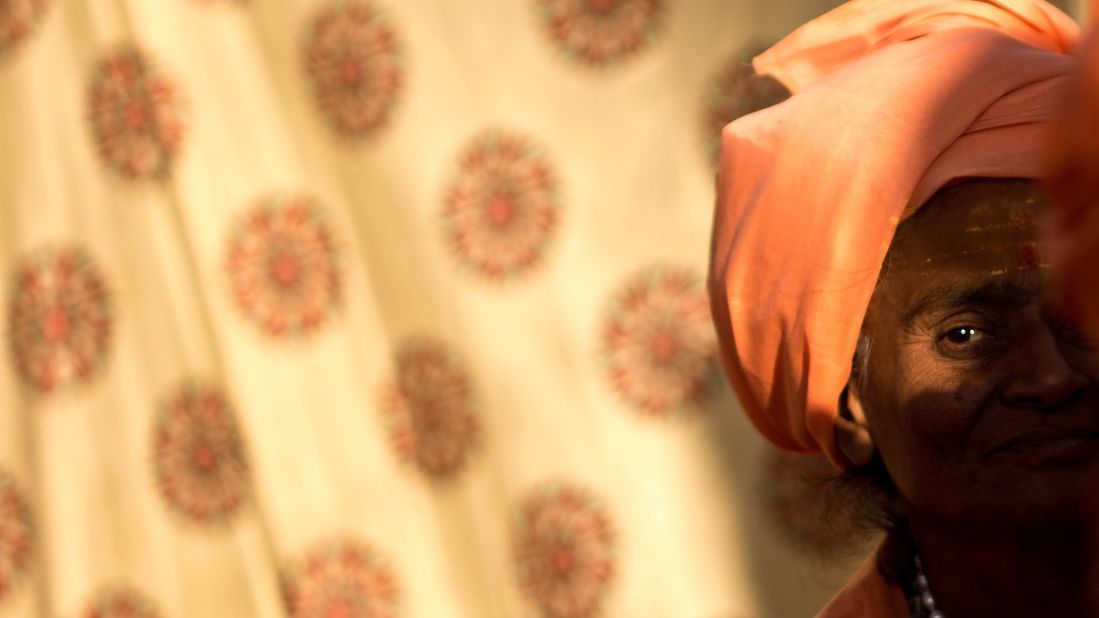 A Sadhvi, or holy woman, sits inside her tent on February 8.