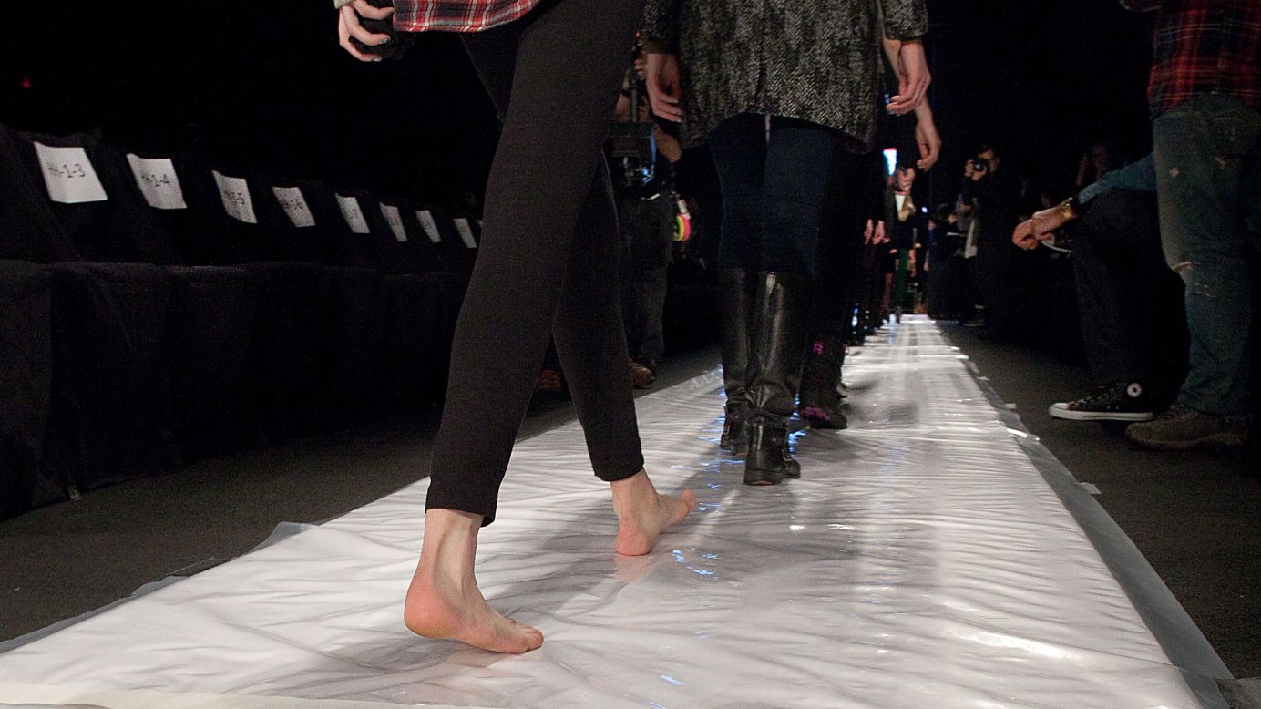 One model practices the runway barefoot at the Rebecca Minkoff show February 8.