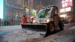 Workers shovel snow in Times Square in New York on February 8, 2013 during a storm affecting the northeast US. The storm was forecast to bring the heaviest snow to the densely-populated northeast 