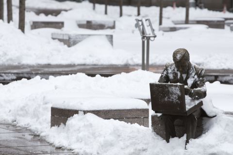 The sculpture "Double Check" by John Seward Johnson II is seen in Zuccotti Park following a major winter storm on Saturday in New York City on Saturday.