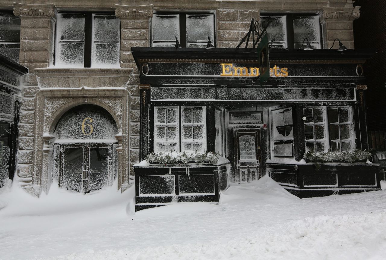Emmet's on Beacon Street is covered in snow in Boston on Saturday.