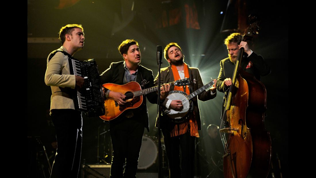 Left to right: Musicians Ben Lovett, Marcus Mumford, "Country" Winston Marshall and Ted Dwane of Mumford & Sons perform "I'm on Fire."