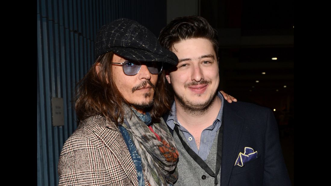 Actor Johnny Depp and Marcus Mumford of Mumford & Sons attend the Musicares gala.