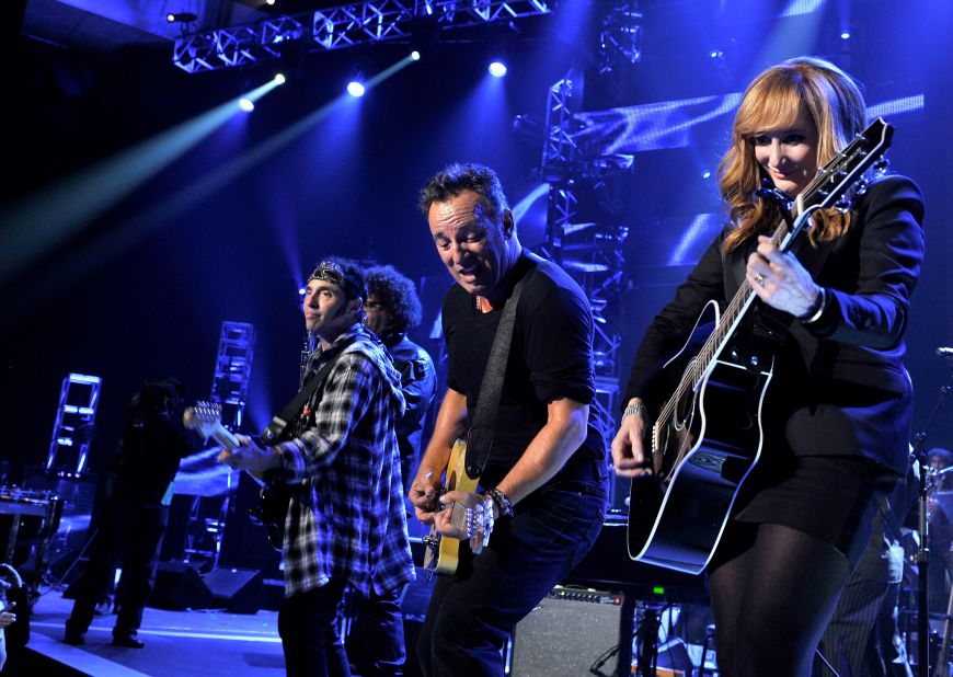 Springsteen and Patti Scialfa perform onstage.