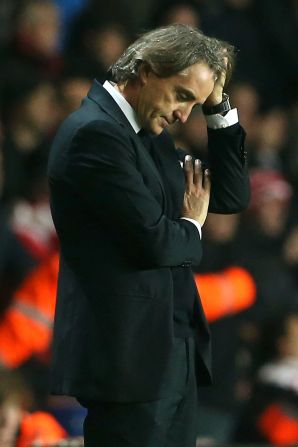 English Premier League leaders United are in pole position to reclaim the title from Manchester City, whose manager Roberto Mancini was furious with his players after a 3-1 defeat at Southampton. 