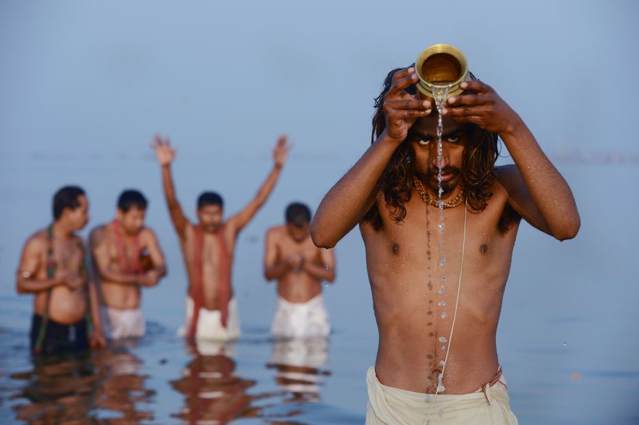 Hindu devotees pray as they bathe in the Sangam -- the confluence of the Yamuna, Ganges and mythical Saraswati rivers -- at the Kumbh Mela in Allahabad, India, on Sunday, February 10.