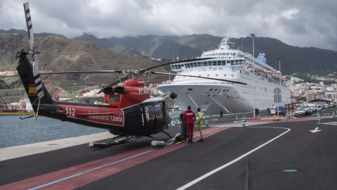 A rescue helicopter arrives at an accident that resulted in the death of five cruise ship crew members in Spain's Canary Islands.