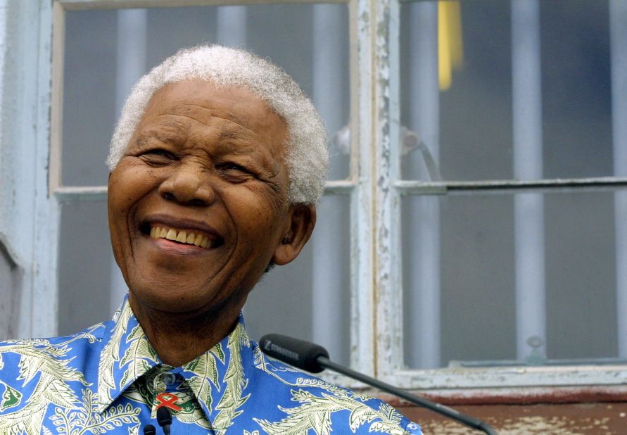 Former South African President Nelson Mandela struggled against apartheid for much his life. Here he is shown in 2003, speaking in front of his former prison cell on Robben Island. Mandela was imprisoned in 1963 and released on February 11, 1990. 