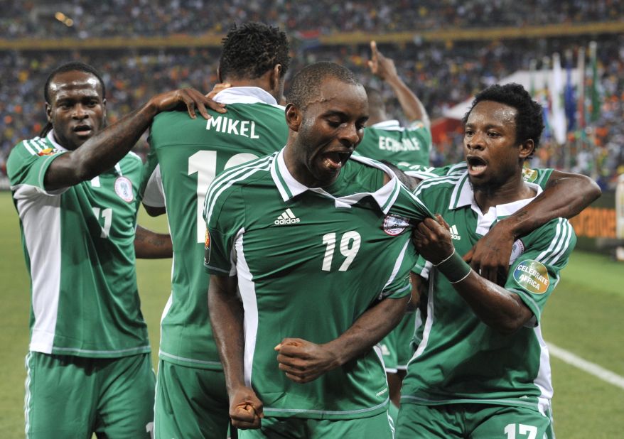 Sunday Mba (center) celebrates with his Nigeria teammates after scoring the only goal of the final against Burkina Faso.