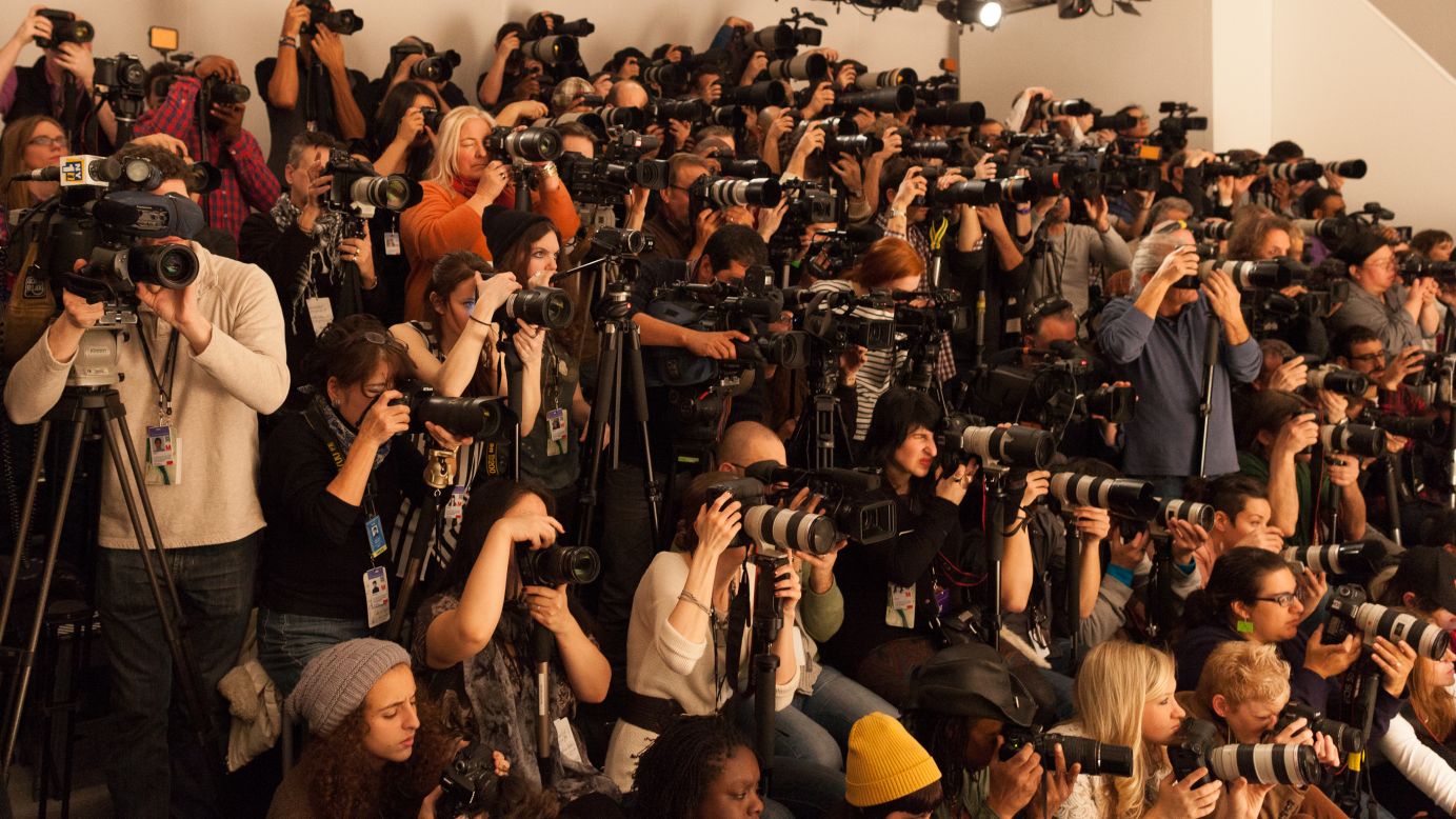 Photographers cram together to shoot the runway on February 10.