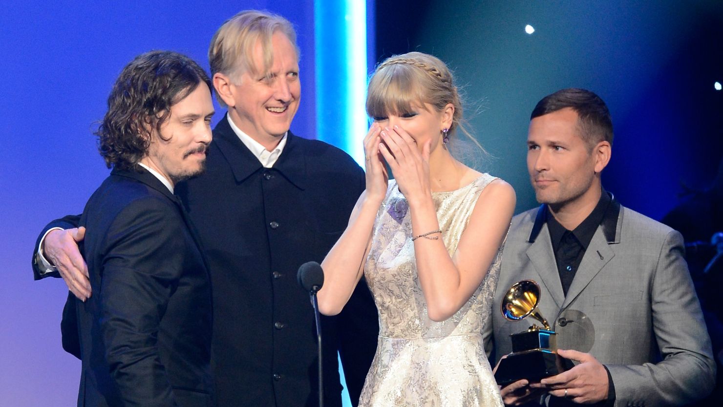 Taylor Swift accepts the Grammy award for best song written for visual media along with John Paul White and T Bone Burnett.