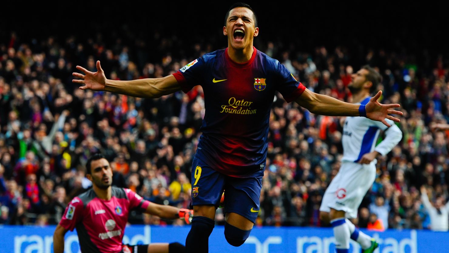 Alexis Sanchez celebrates after scoring Barcelona's opening goal against Getafe on Sunday.