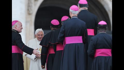 Benedict  talks with bishops in Saint Peter's Square at the Vatican after his weekly general address in November 2009.  
