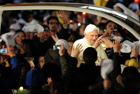 The pope salutes from his popemobile in St. Peter's Square in March 2010.