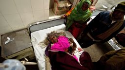 Bittan, 55, lies on a bed at the Railway Hospital in Allahabad after being injured in a stampede at the main railway station.