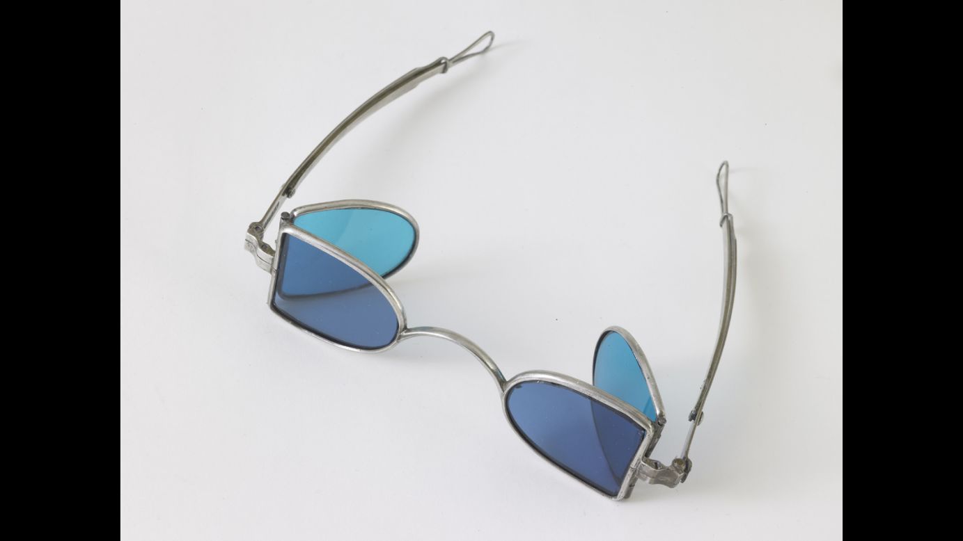In the 19th century, people wore these kinds of glasses, called "eye protectors" or "railroad glasses." This pair, from 1850, has steel frames with four colored lenses. They were meant to protect weak eyes from bright light, dust and wind while riding or driving. The lenses are tinted with shades of blue and blue-green, although other lenses could also be amber and gray. 