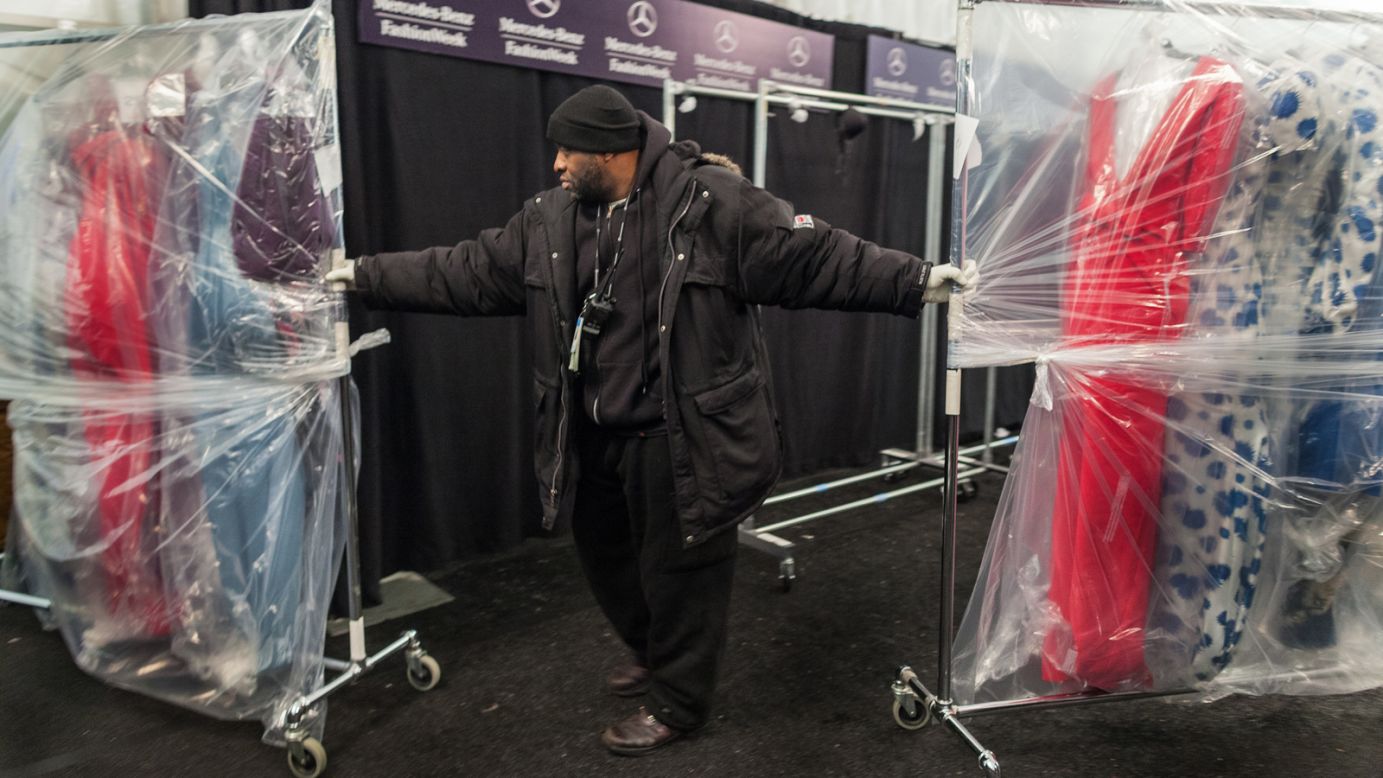 Movers transport clothes after each show.
