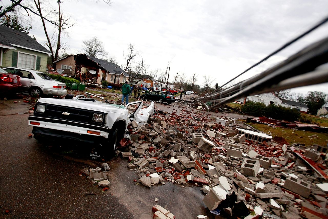A crushed car sits amid the debris in Hattiesburg on February 11.