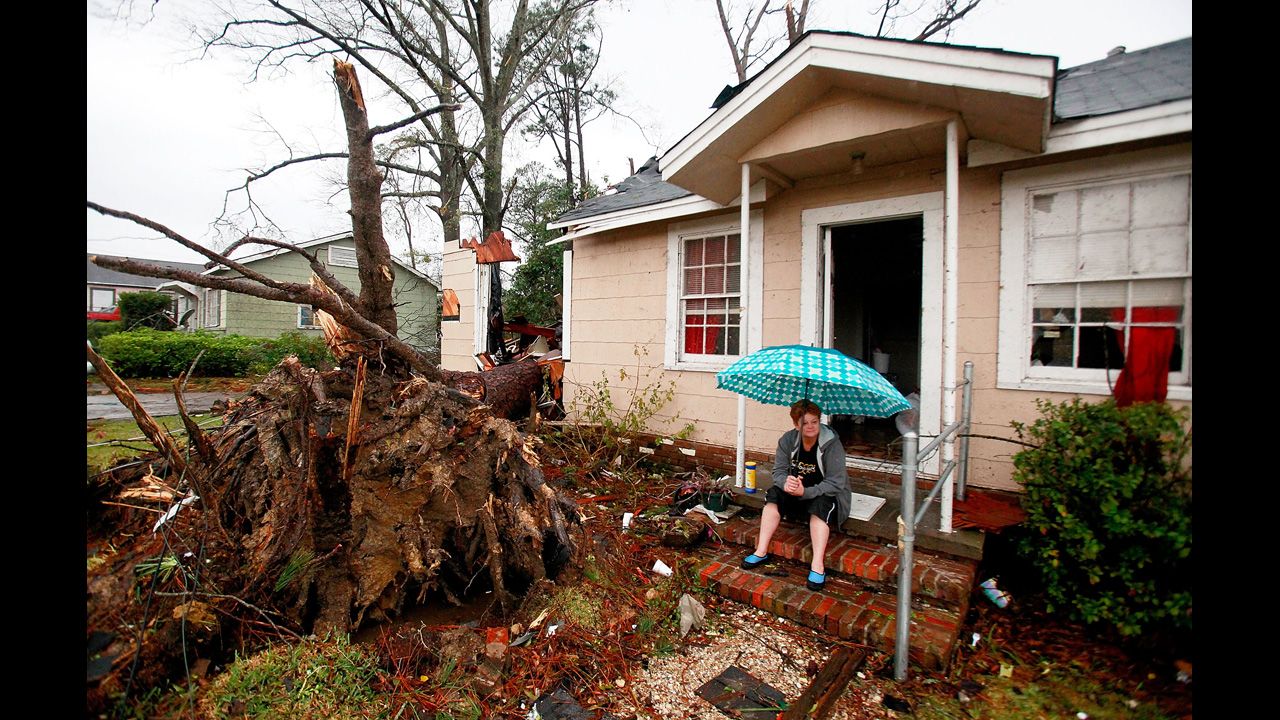 Ellen Chmiel surveys the damage from the steps of her Hattiesburg home on February 11.