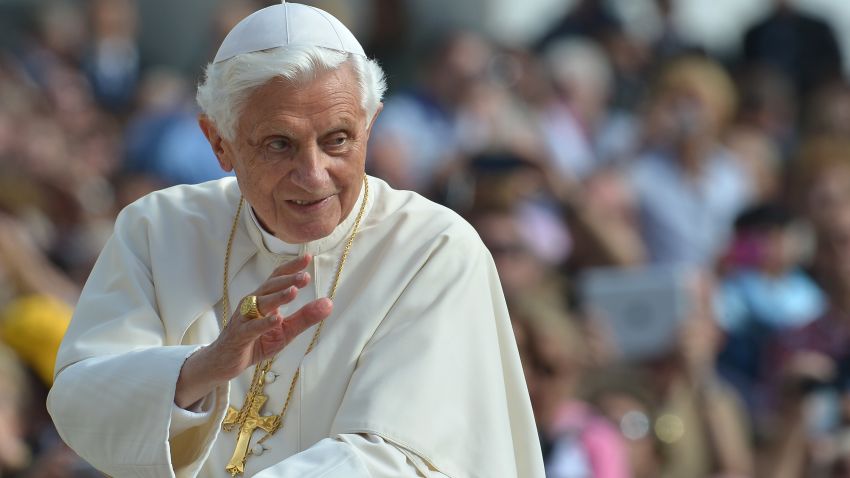 Pope Benedict XVI waves to pilgrims as he arrives at St Peter's square for his weekly general audience on October 17, 2102 at The Vatican. 