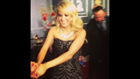 Carrie Underwood navigates the red carpet with a little help from her friends. By the end of the evening, the Grammy winner would admit she was ready to slip into something a little more comfortable.