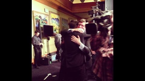 Marcus Mumford and his proud father, John, share a heart-meltingly sweet bear hug backstage after Mumford & Sons' "Babel" won album of the year.