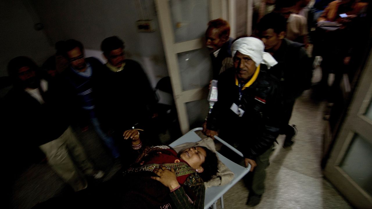 Hospital attendants wheel in a woman injured in the stampede in Allahabad on Sunday, February 10. The stampede occurred about 7 p.m. after someone fell from a platform bridge in Allahabad, the scene of this year's Kumbh Mela festival, North-Central Railway spokesman Sandeep Mathur said. He said the station was overcrowded with pilgrims, but denied reports that the bridge had collapsed.