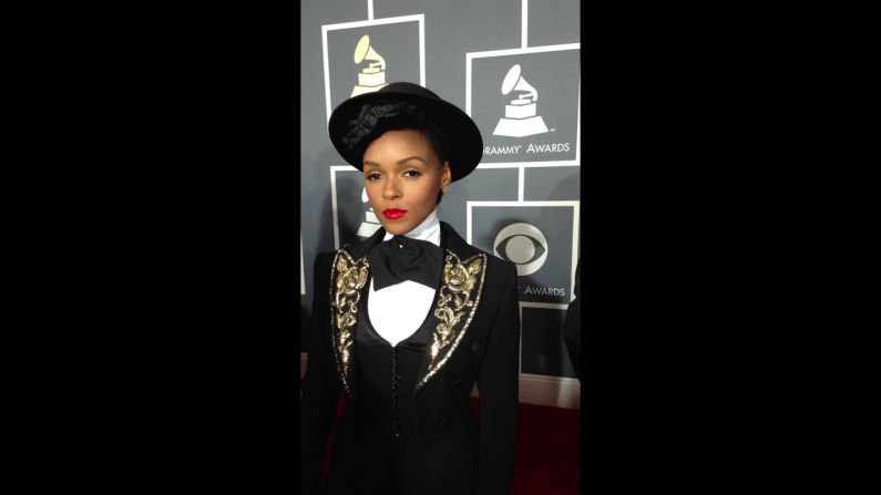 Just outside the frame is total chaos, but Janelle Monae remains perfectly poised - not to mention totally poreless. No Instagram filter was applied to this photo. 