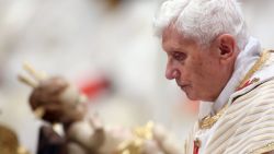  Pope Benedict XVI walks in front the crib as he attends the Christmas night mass at the St. Peter's Basilica on December 24, 2012 in Vatican City.