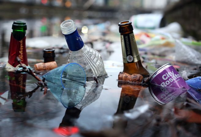 Trash from the Rose Monday carnival celebrations lies in a canal in Düsseldorf.