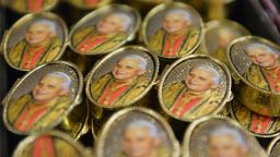 Souvenirs with portraits of Pope Benedict XVI are displayed in a shop near the Vatican.