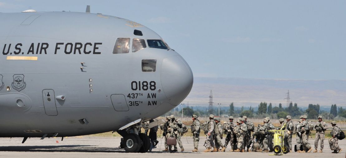 US soldiers board a plane to Afghanistan from a base in Bishkek, Kyrgyzstan in July 2010.