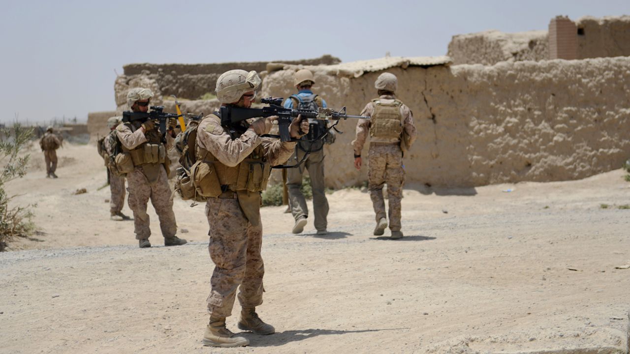 U.S. Marines from Kilo Company of the 3rd Battalion 8th Marines Regiment conduct a patrol in Garmser, Helmand Province on June 27, 2012. The 130,000 NATO troops are due to leave Afghanistan by the end of 2014 and there are fears that their exit will lead to a reduction in rights and freedoms in the war-torn country. AFP PHOTO / ADEK BERRY (Photo credit should read ADEK BERRY/AFP/GettyImages)