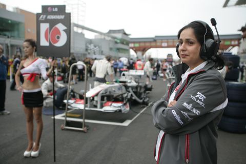 Kaltenborn said she is not disturbed by the use of "grid girls", seen here at the 2011 Korean Grand Prix, in Formula 1. "I think girls are prettier to look at than if you had men in those roles," she said.