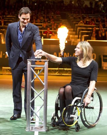 "The ultimate dream is for wheelchair tennis to be a very integrated sport," says Vergeer, seen here with 17-time grand slam winner Roger Federer at the integrated men's tour event in Rotterdam. 