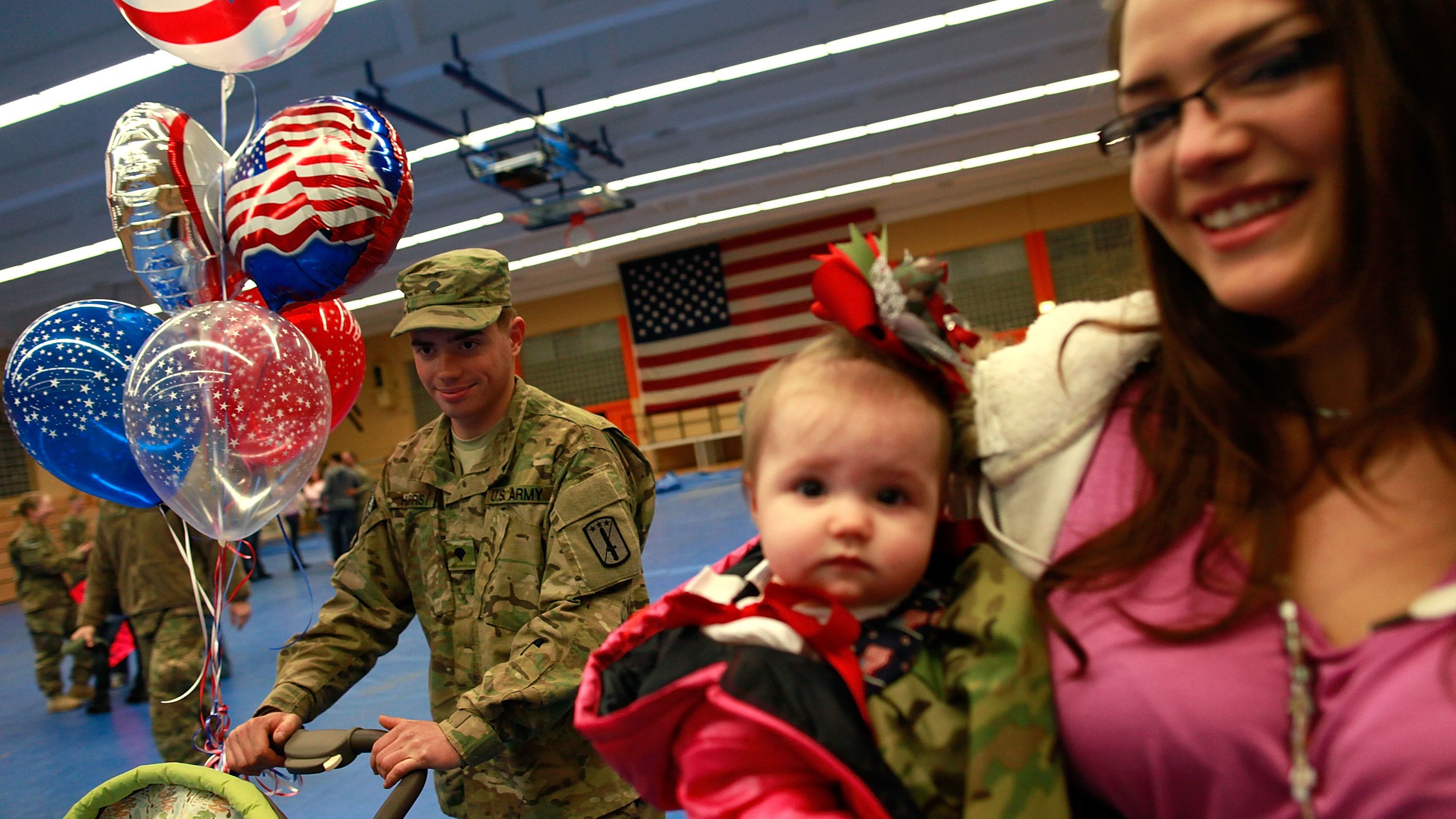 A soldier of the 170th U.S. Army Infantry Brigade, returned from Afghanistan, reunites in Germany with his family.