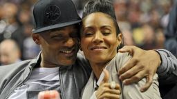 Will Smith and his wife Jada Pinkett Smith share a moment on the sideline during the game between the Philadelphia 76ers and Miami Heat at the Wells Fargo Center on March 16, 2012 in Philadelphia, Pennsylvania. The Heat won 84-78. NOTE TO USER: User expressly acknowledges and agrees that, by downloading and or using this photograph, User is consenting to the terms and conditions of the Getty Images License Agreement. (Photo by Drew Hallowell/Getty Images) 