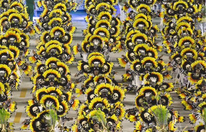 Approximately 3,000 to 5,000 members of each school participate in full-blown costumes that differ every year. Pictured here are members of Imperatriz Leopoldinense samba school.