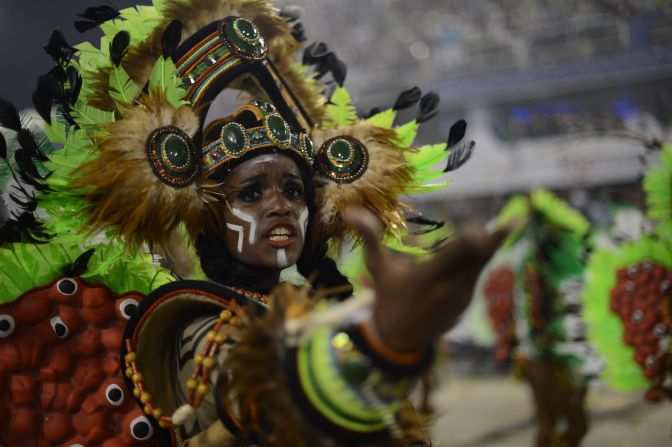 A reveler of Imperatriz Leopoldinense samba school performs during the second night of Carnival parades at the Sambadrome in Rio de Janeiro on February 12, 2013.