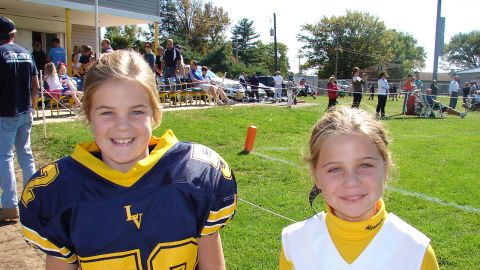Alexandra, 11, a cheerleader, likes to watch her twin sister play and wants the rule changed.