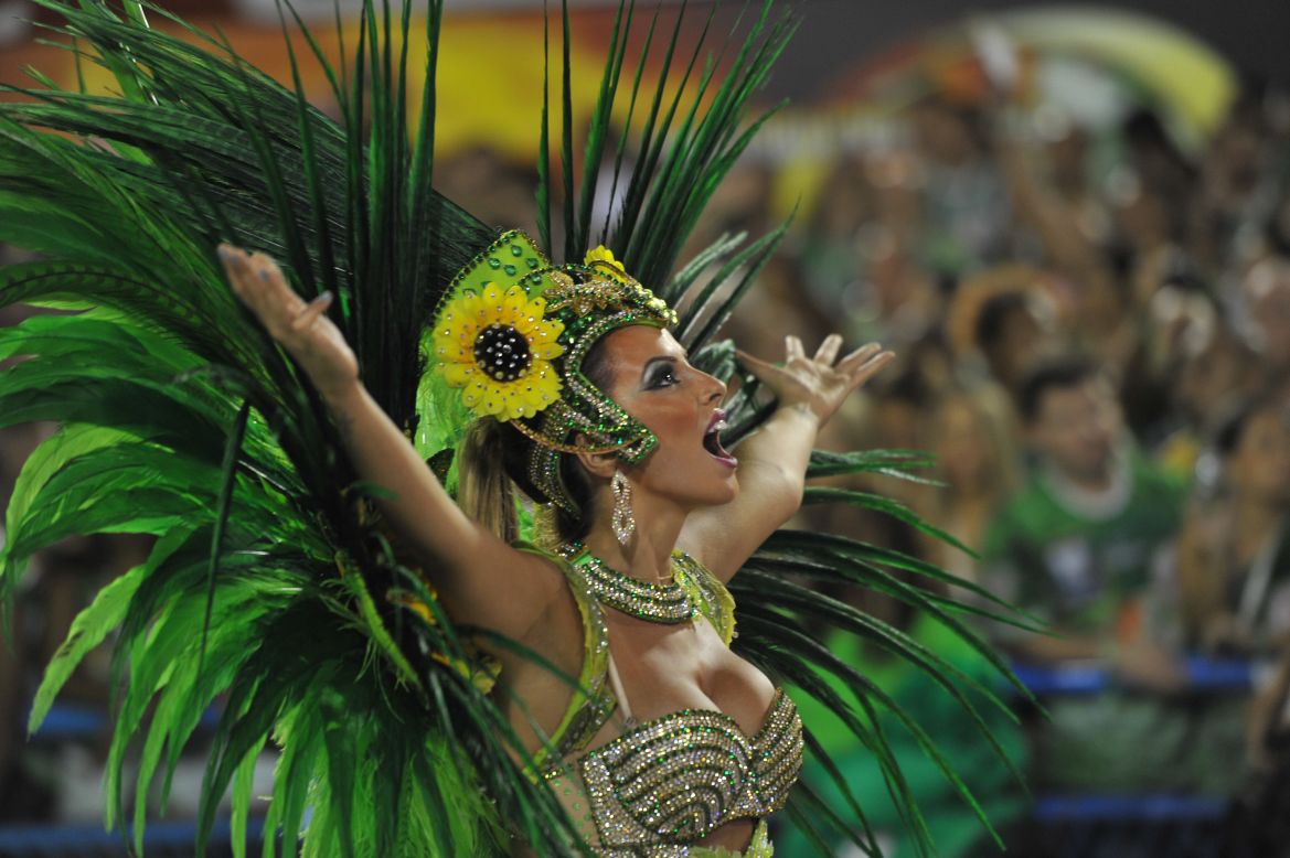 Thousands of performers took part in Rio de Janeiro's Carnival samba parade. The event is famed for its color, dancing, amazing costumes and beautiful performers. Here, a member of the Vila Isabel samba school gets into the spirit.