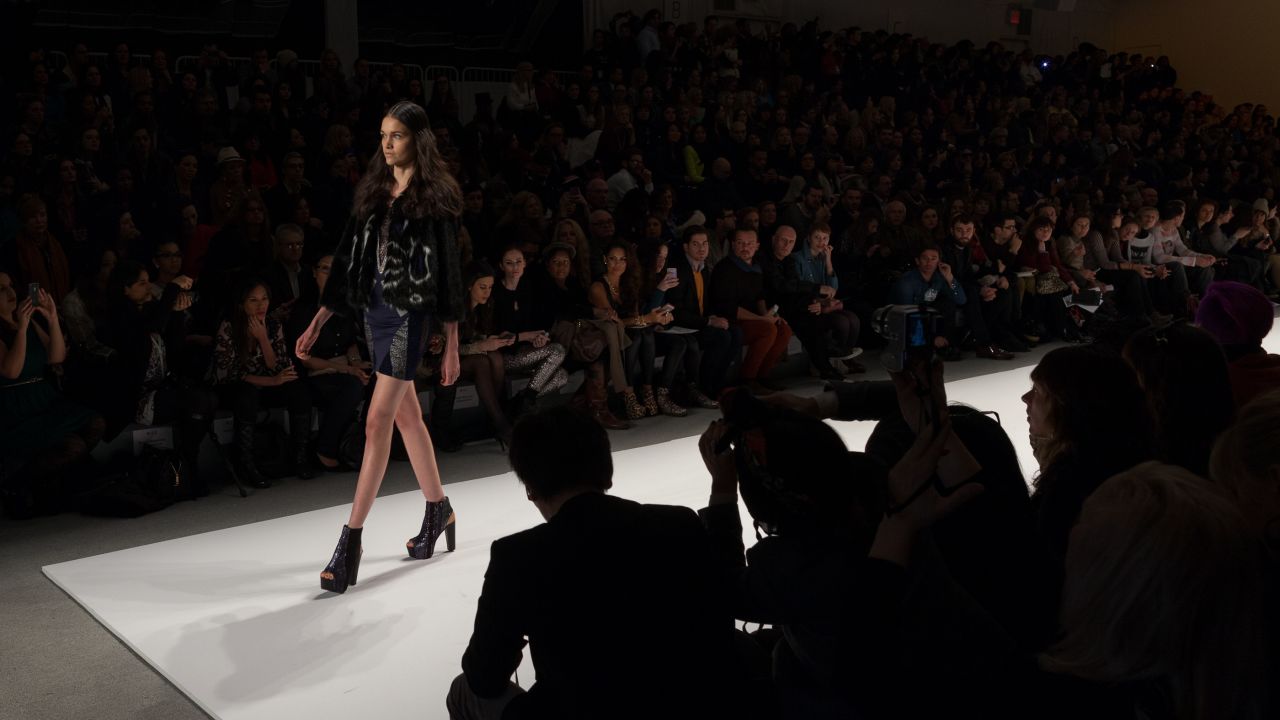 A model approaches the end of the runway during the Custo Barcelona show on February 10.