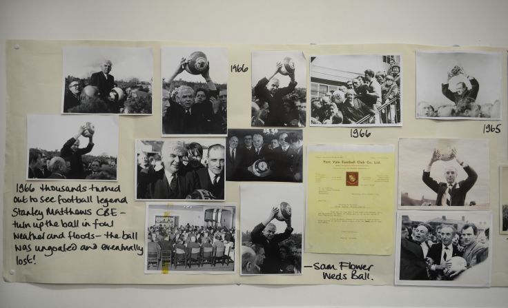 Historical pictures are displayed in the town hall before rival teams the 'Up'ards and Down'ards' battle for the ball in the annual Shrove Tuesday 'no rules' football match.