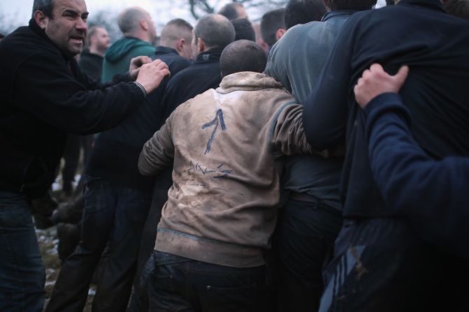 The game is played between two informal teams, the 'Up'ards' and the 'Down'ards' -- depending on which side of the town people live.