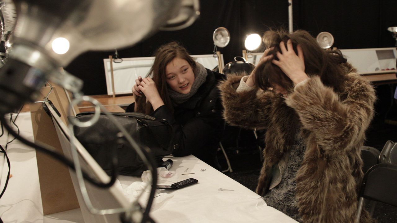 Models let their hair down after the Tadashi Shoji show on February 7.