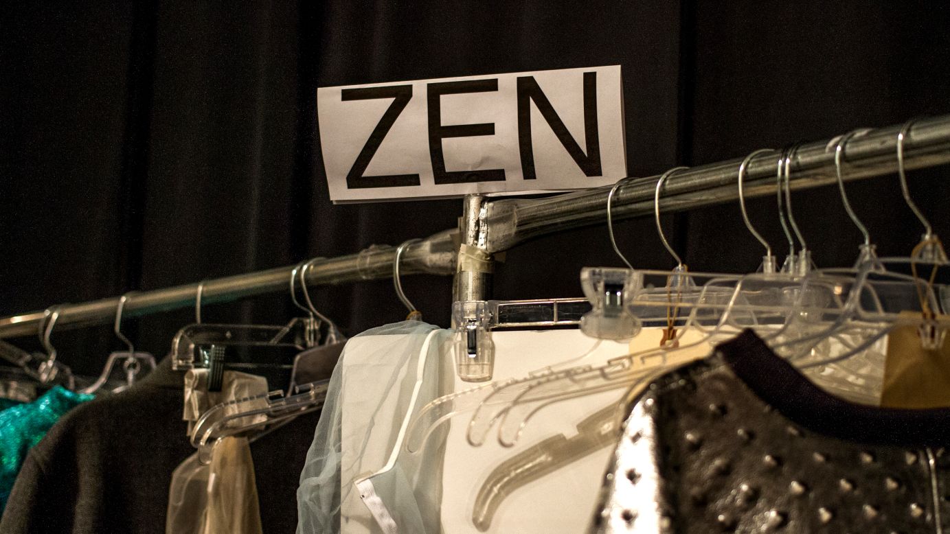 A model's nametag hangs above a clothing rack backstage on February 13.