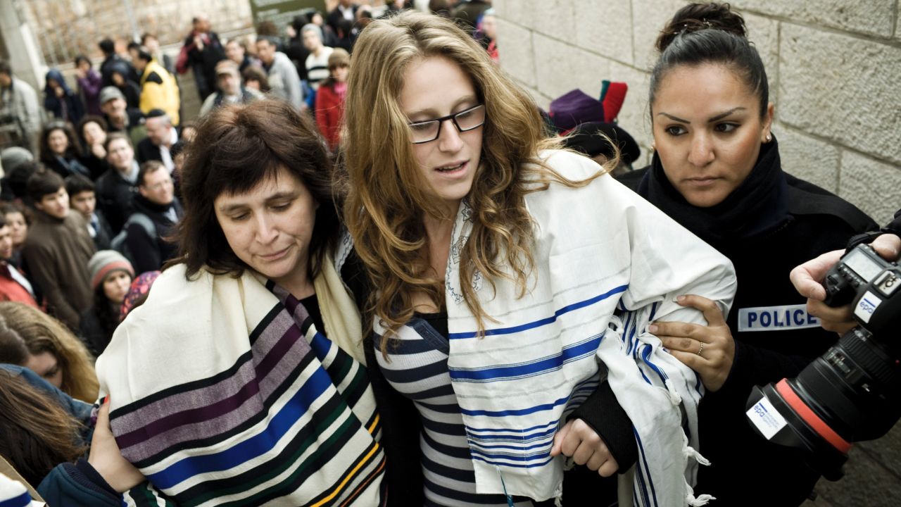 Israeli police arrest American Rabbi Susan Silverman (L) and her teenage daughter Hallel Abramowitz (C) on Monday.