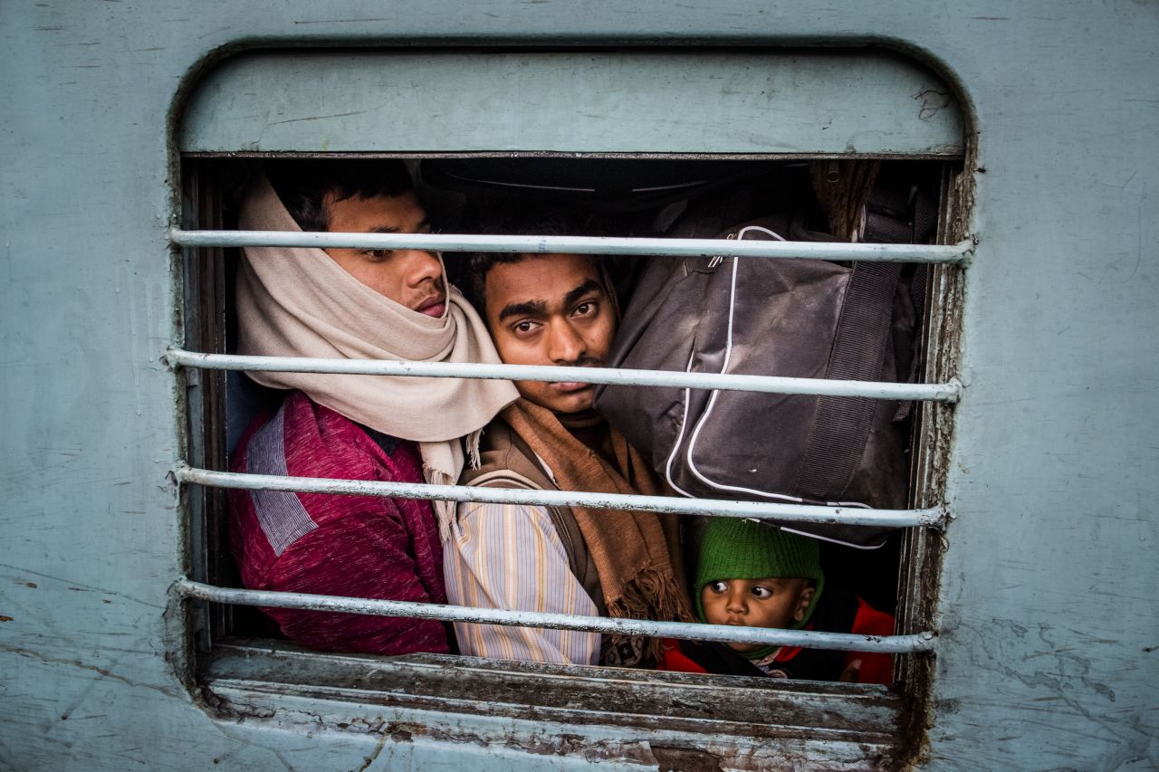 Hindu pilgrims pack tightly into a train car at Allahabad train station on Monday, February 11, where a deadly stampede occurred the night before.
