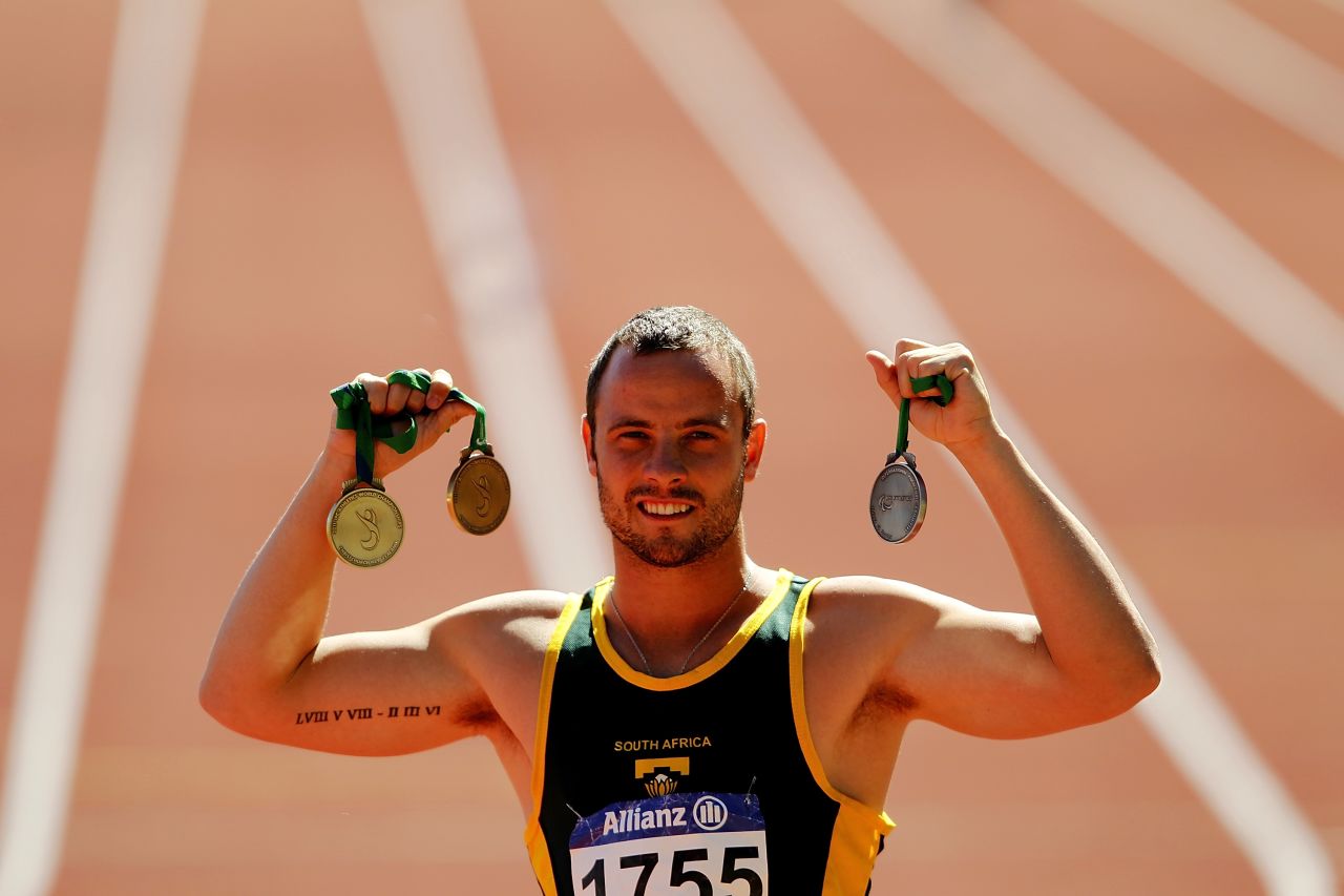 Pistorius poses with his medals from the IPC Athletics World Championships in January 2011. He won three world titles there but lost the 100-meter T44 final to Singleton. It was his first loss in a race over 100 meters since the 2004 Paralympic Games.