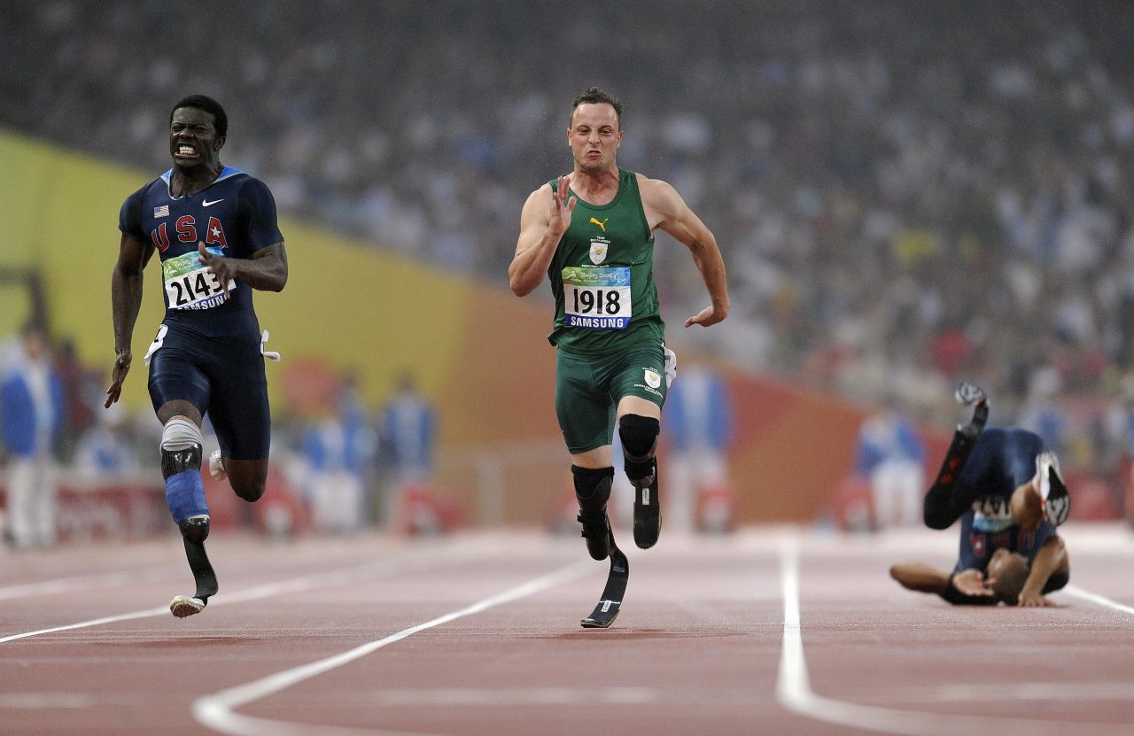 Pistorius wins gold ahead of Americans Jerome Singleton, left, and Marlon Shirley, right, in the 100-meter T44 during the 2008 Beijing Paralympic Games.